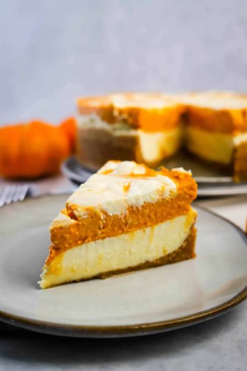 slice of instant pot pumpkin cheesecake on a plate