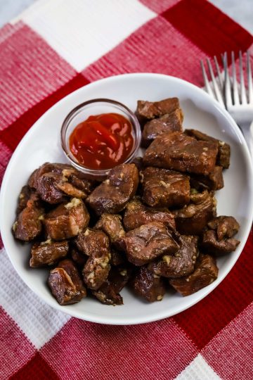 air fryer steak bites on a white plate