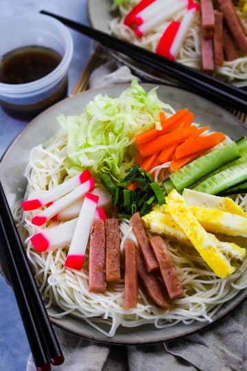 close up of somen salad on a gray plate