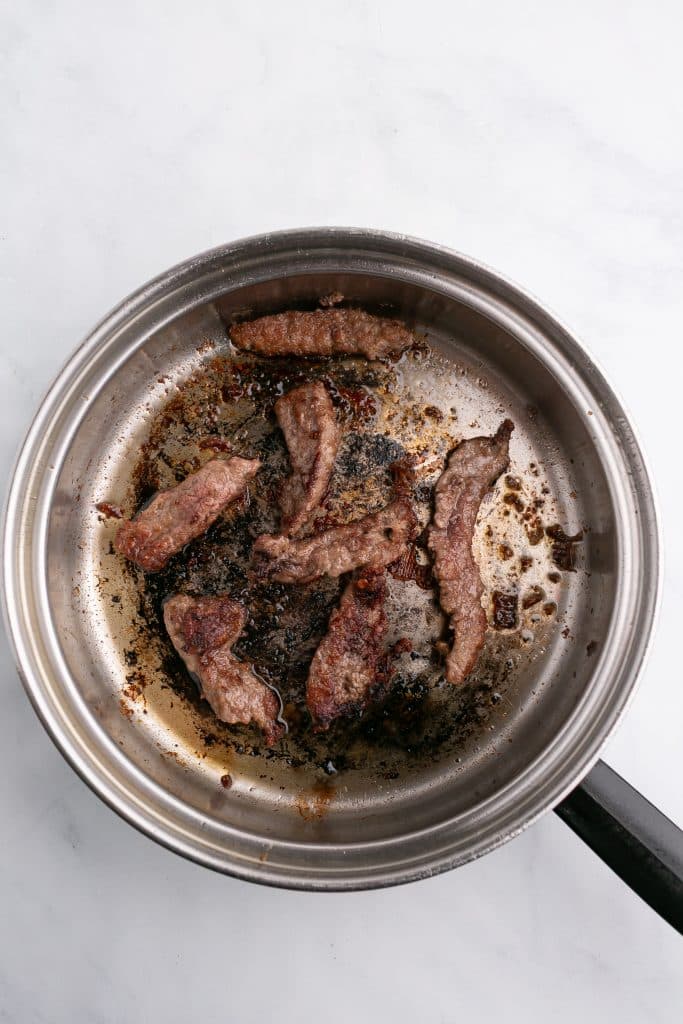 mongolian beef cooking in a pan