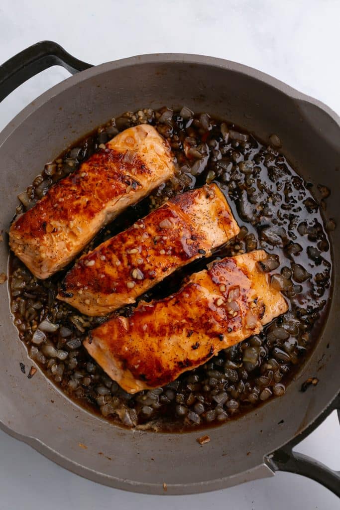 honey garlic salmon in a pan