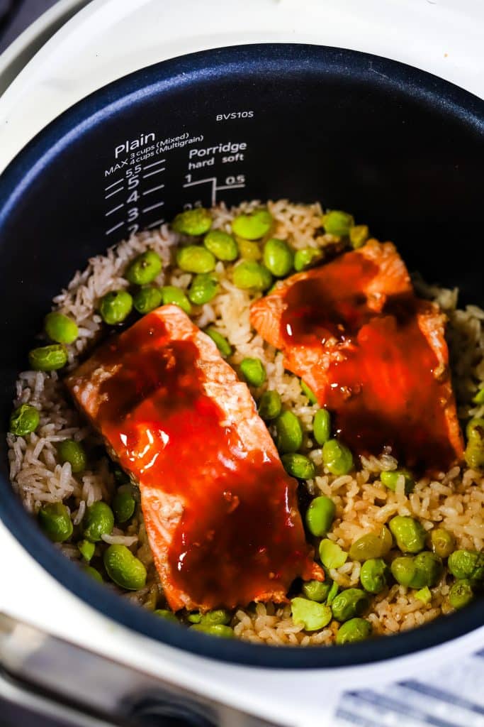 teriyaki glaze on salmon in a rice pot