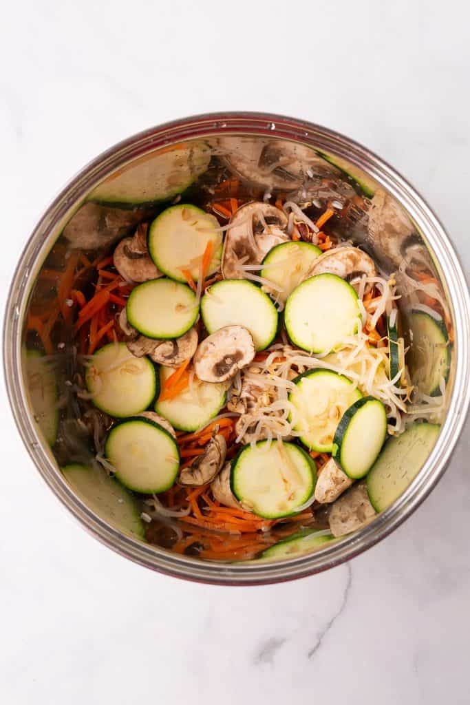 rice cooker bibimbap ingredients in a pot
