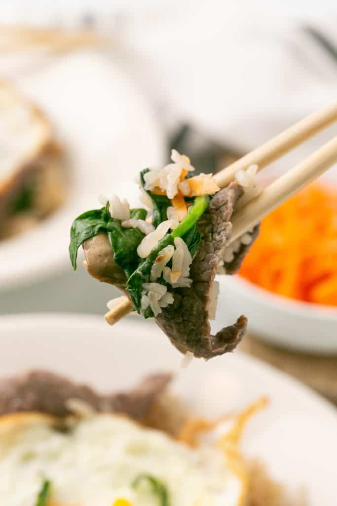 chopsticks picking up bibimbap
